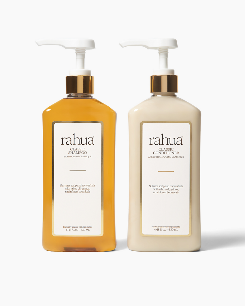 Two bottles of rahua shampoo and conditioner on a white background|variant:16-oz