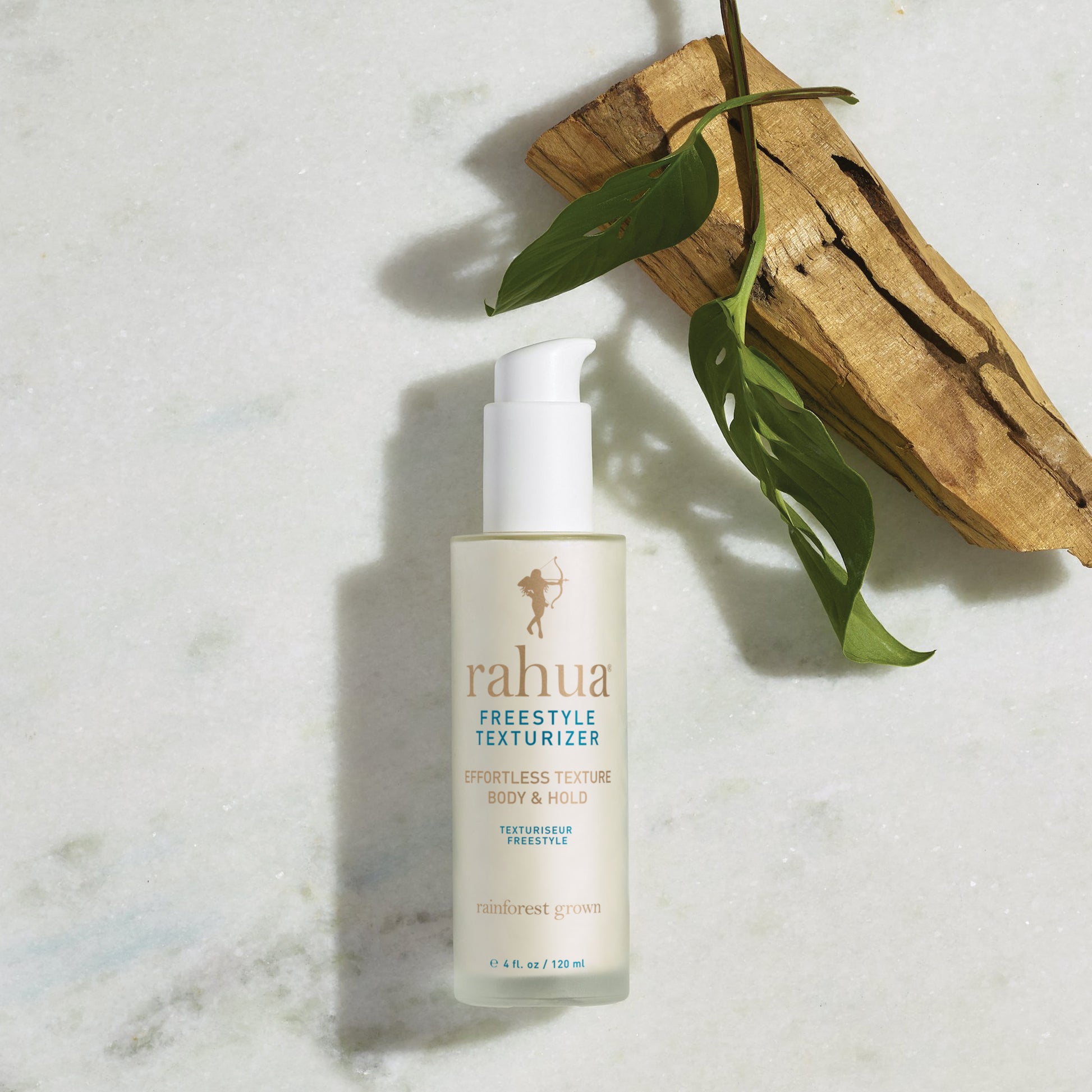 Rahua Freestyle Texturizer bottle with palo Santo Stick and Carnauba Leaves