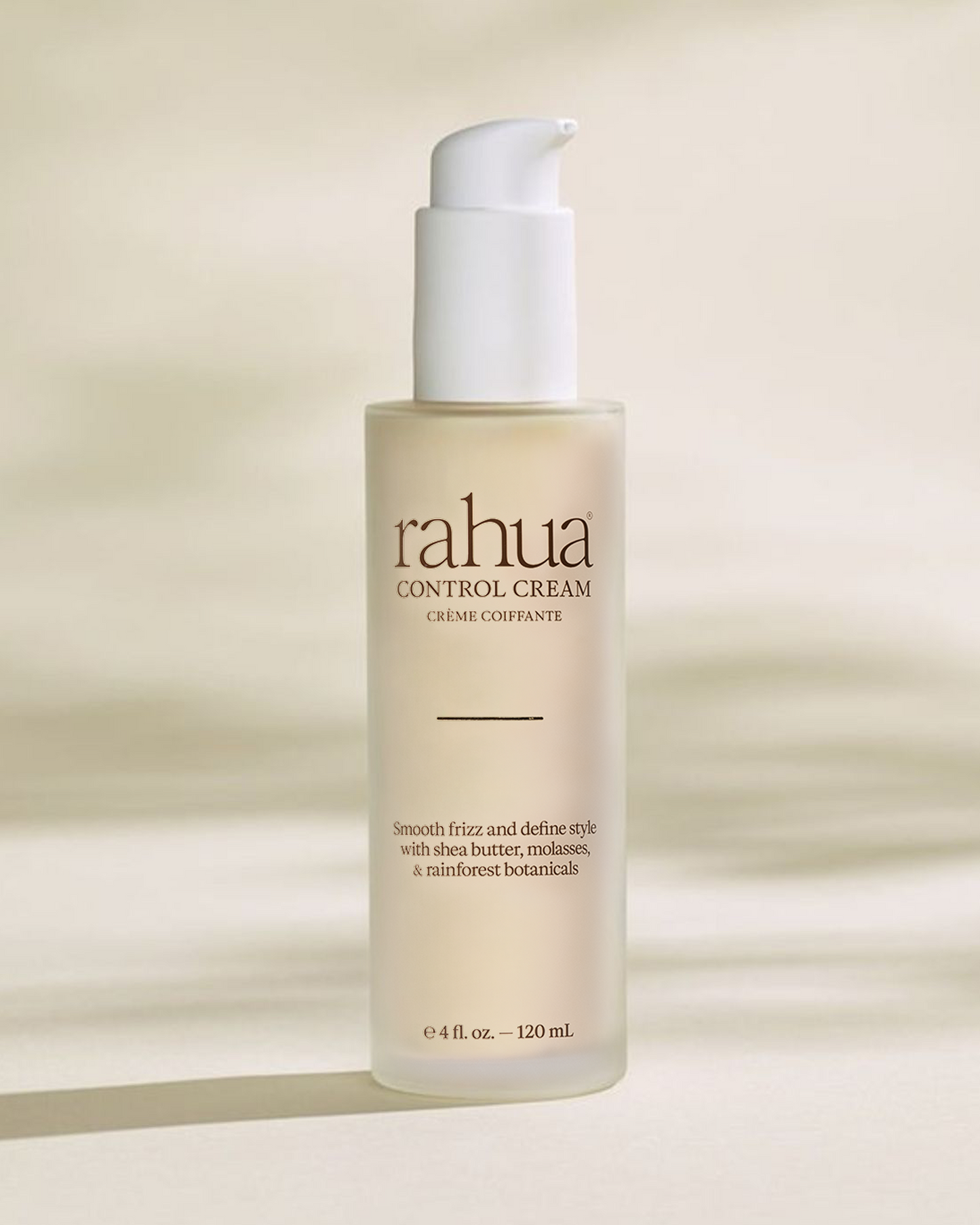 Bottle of rahua control cream on a beige background