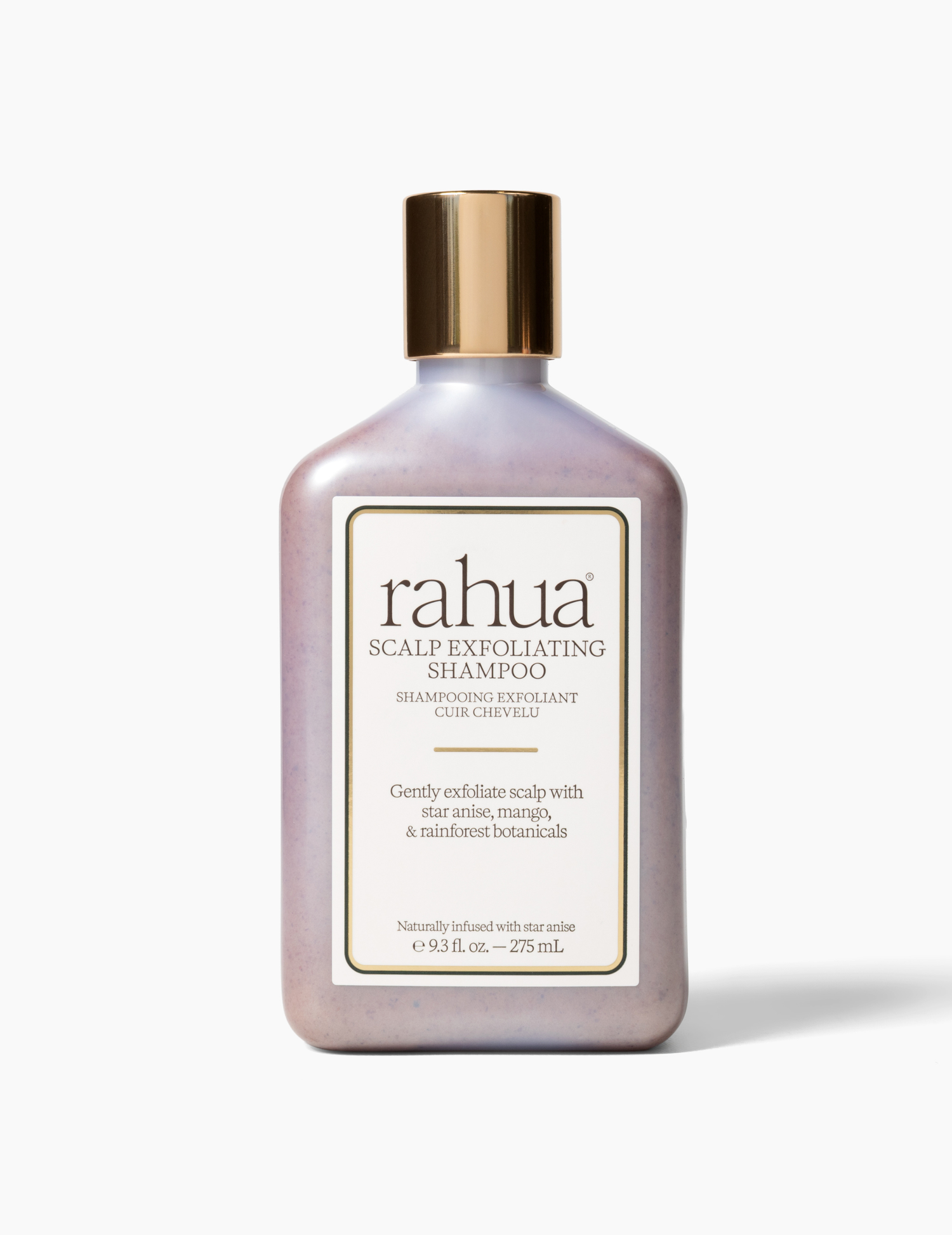 bottle with gold cap with white label and green letter rahua scalp exfoliating shampoo on a soft off white background|variant:93-oz