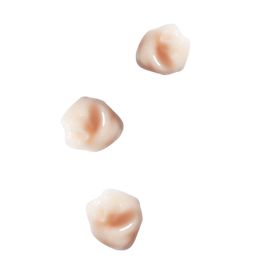 Three small, beige-colored dollops on a white background of the hydration shampoo to show texture|variant:074-oz