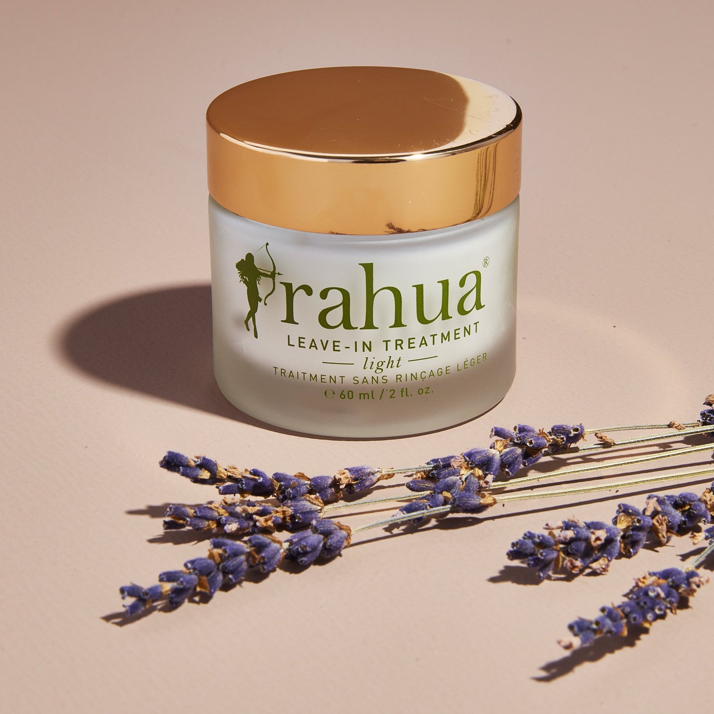 rahua leave in treatment light with some purple plant sticks
