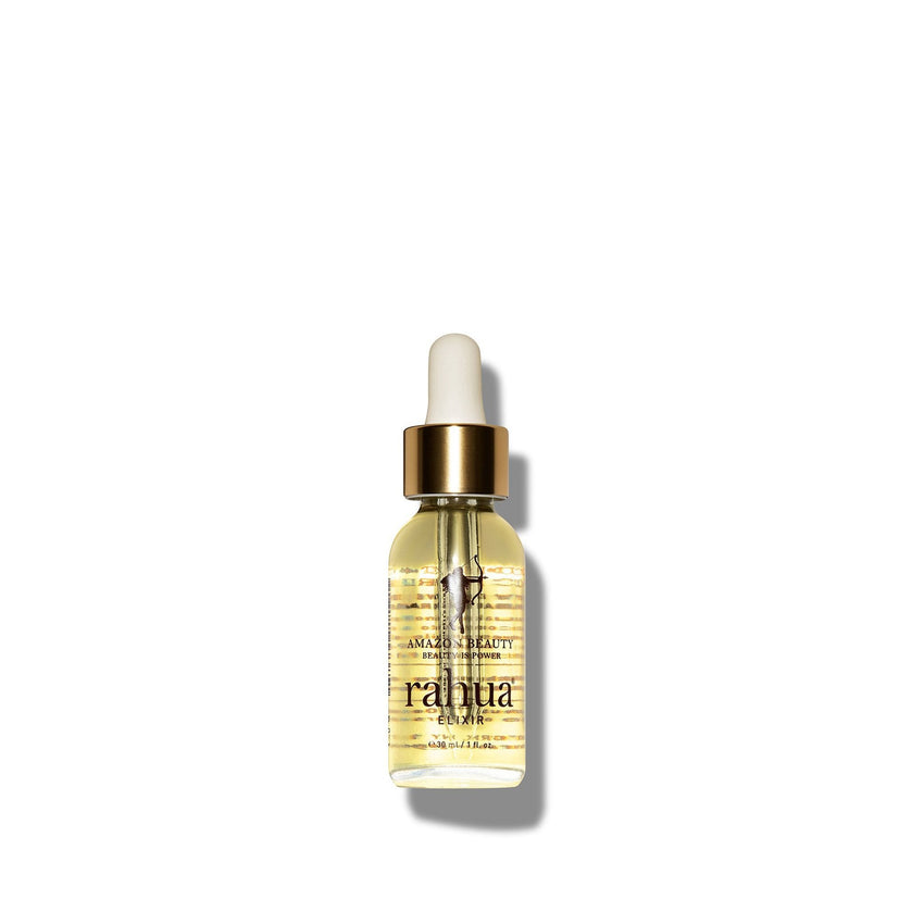 bottle of golden liquid in a glass bottle rahua elixir oil made of 100% rahua oil on a plain white background|variant:1-oz