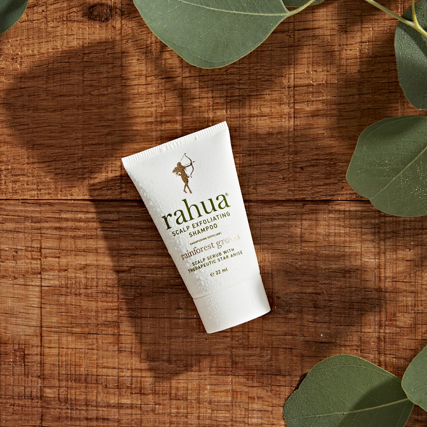 white misted over tube of scalp exfoliating shampoo on a wooden background travel size travel friendly tsa safe tsa compliant 0.74 oz|variant:074-oz