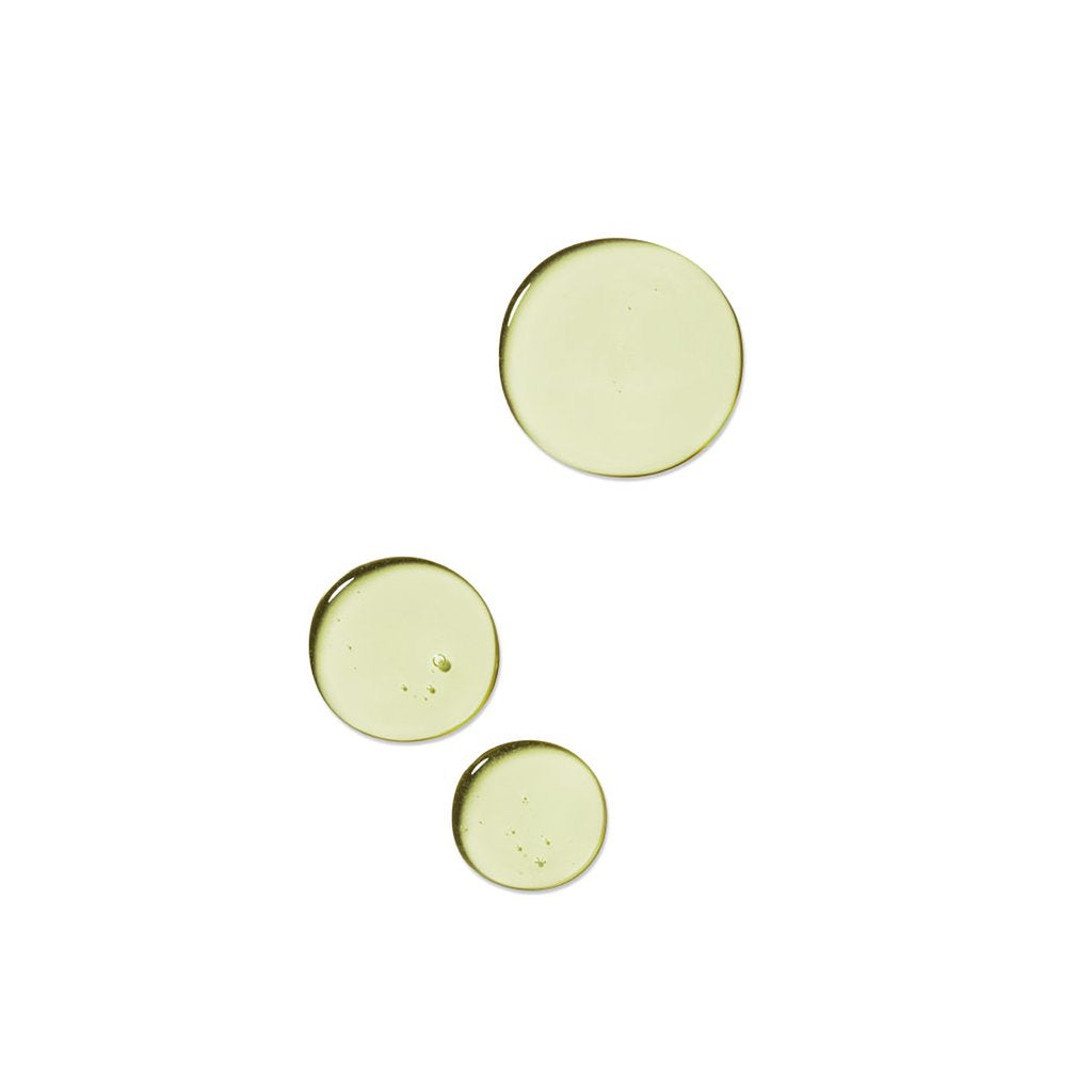 three dots of thin greenish gel liquid rahua voluminous shampoo on a white background to show texture|variant:93-oz