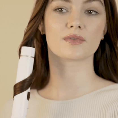 Woman using hair dry after applying Blowout Essentials Kit